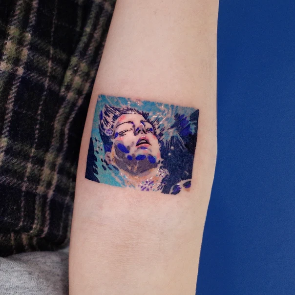 Illustrative Face, Water tattoo on Forearm