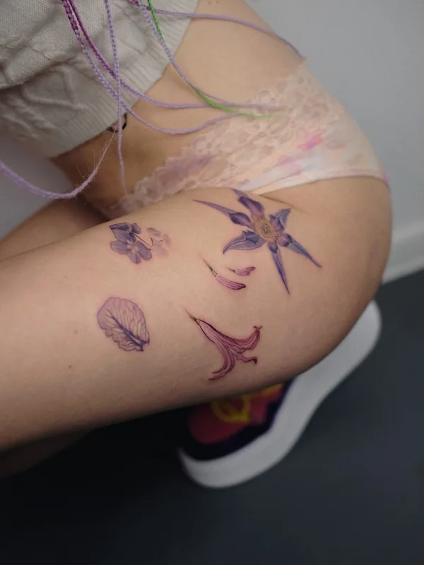 female color botanic tattoo on thigh #53603 | Tattoo Artist Елена Федченко