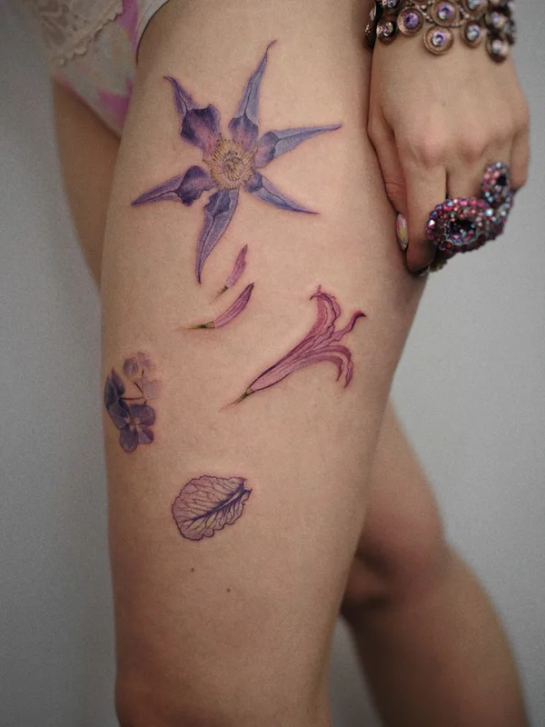 female color botanic tattoo on thigh #53610 | Tattoo Artist Елена Федченко