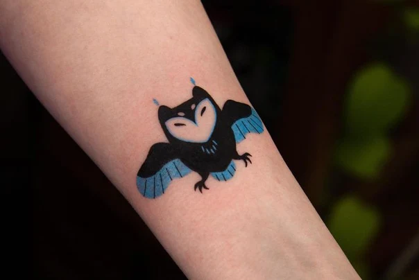 Cartoon Owl tattoo on Forearm