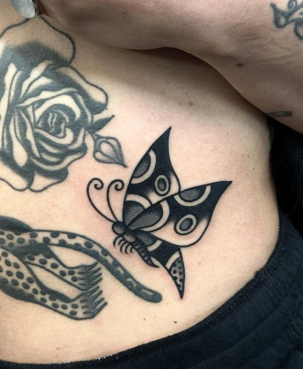 Blackwork Butterfly tattoo on Ribcage