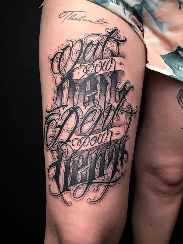 female black and grey lettering 纹身 在 thigh #66547 | 纹身师 AserOne