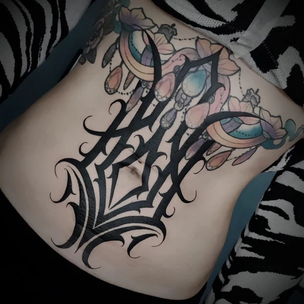 Ornamental Floral, Lettering tattoo on Stomach