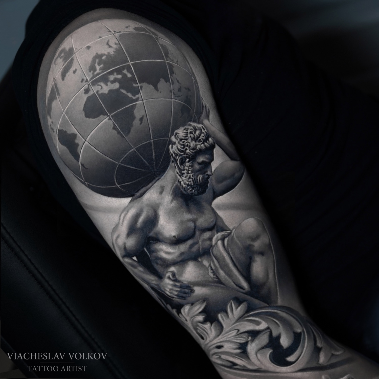 Oneline Atlas tattooed on the inner forearm, fine line