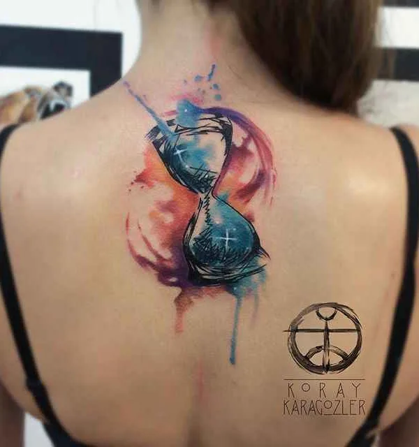 female color watercolor tattoo on upper back #305 | Tattoo Artist Koray Karagözler