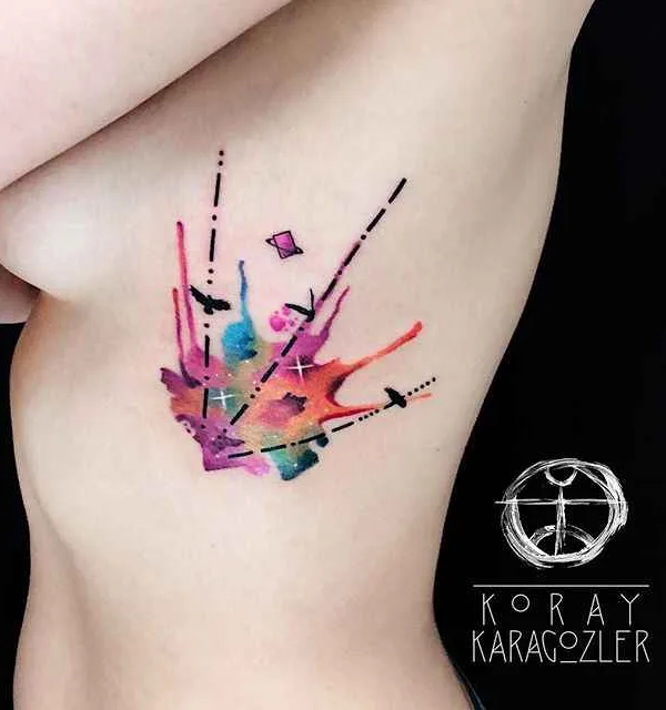 female color watercolor tattoo on ribcage #295 | Tattoo Artist Koray Karagözler