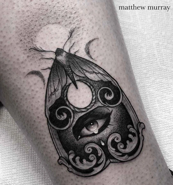 Blackwork Moth, Eye tattoo on Calf
