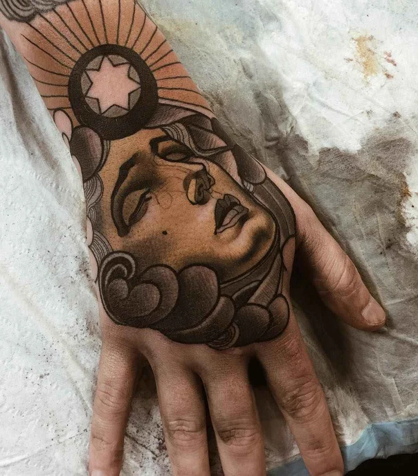 Black & Grey Face, Clouds tattoo on Back of Hand