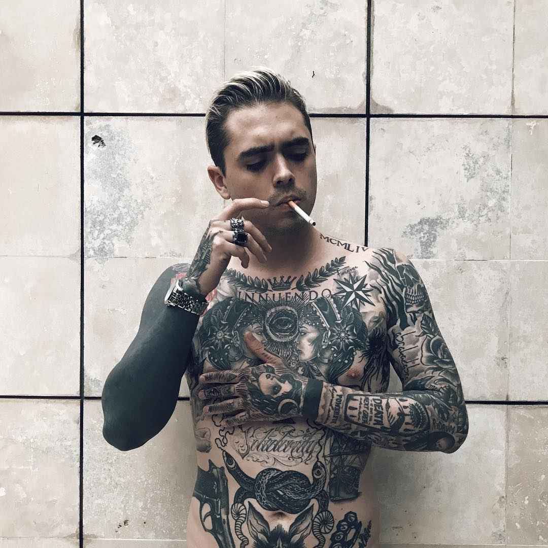 Premium Photo  Hispanic shirtless male model with muscular tattooed torso  standing with hands in pockets