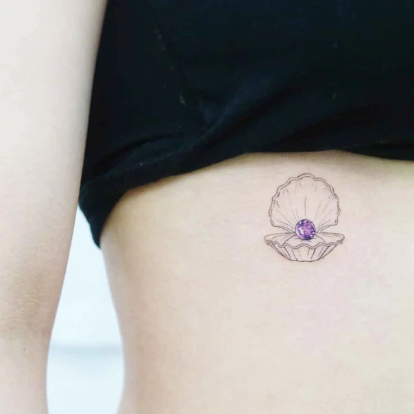 Fineline Shell, Gem tattoo on Side