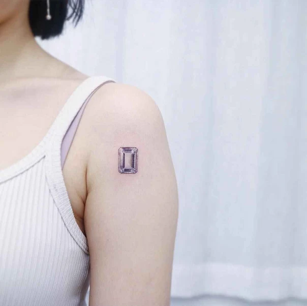 Micro Realism Gemstone tattoo on Upper Arm