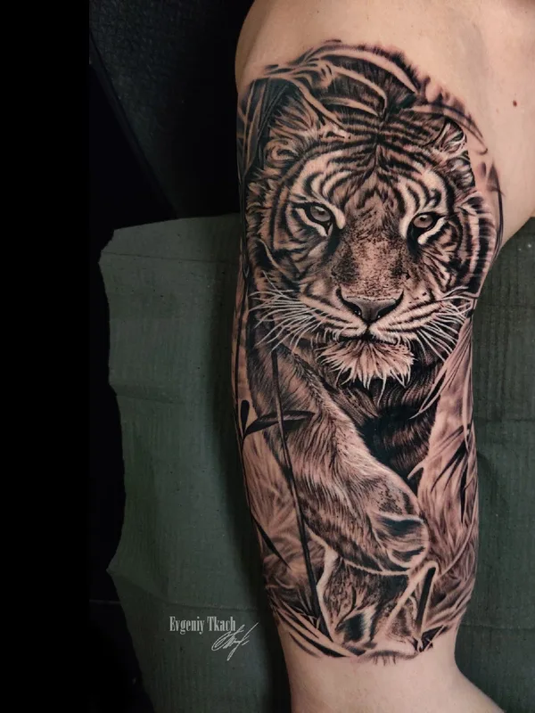 black and grey realism tattoo on upper arm #39711 | Tattoo Artist Евгений Ткач