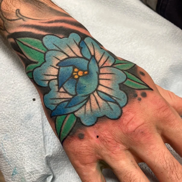 Traditional Flower tattoo on Back of Hand
