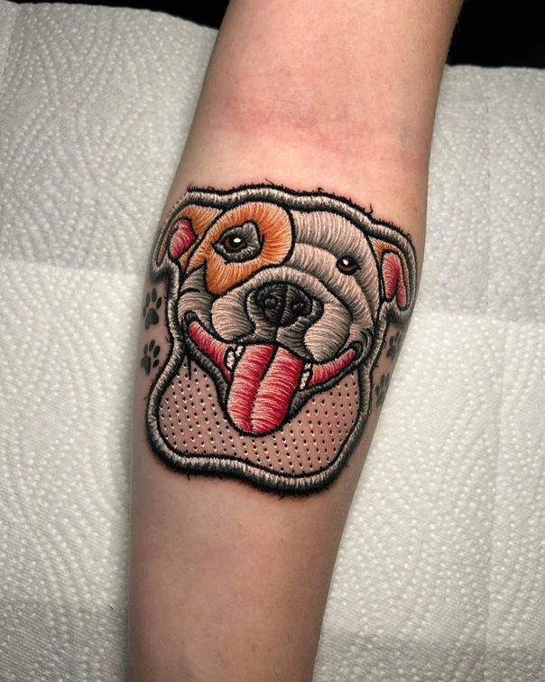 Illustrative Dog, Paw prints tattoo on Forearm