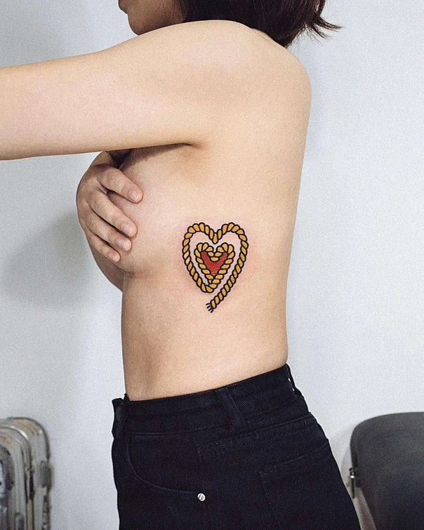 Traditional Heart tattoo on Ribcage