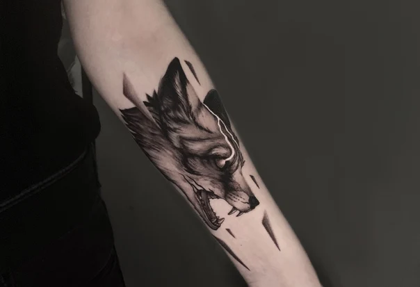 Black & Grey Wolf tattoo on Forearm