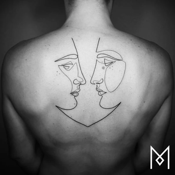 Linework Faces tattoo on Upper Back