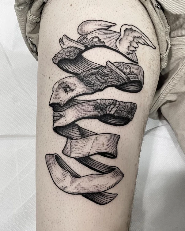 Engraving Face, Ribbon tattoo on Thigh
