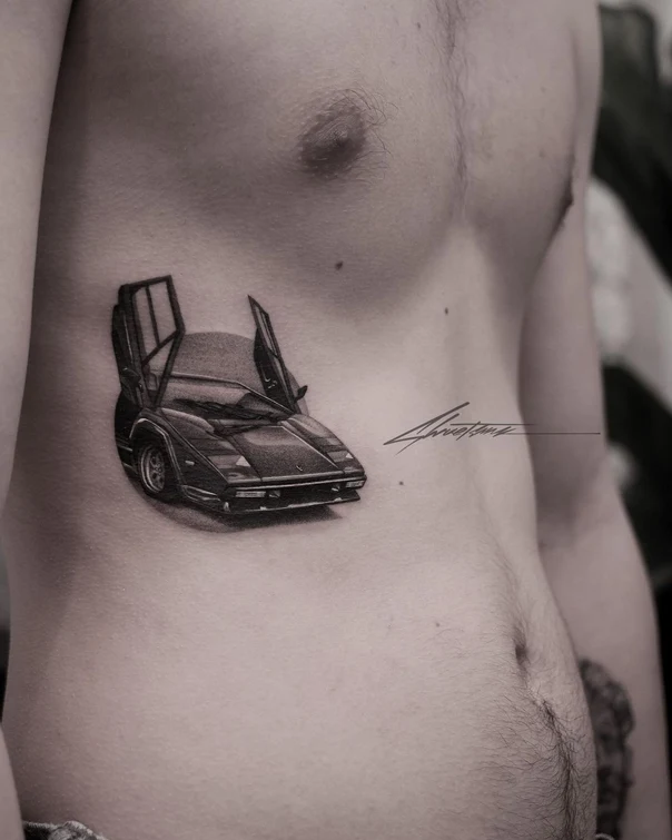 Black & Grey Car tattoo on Stomach