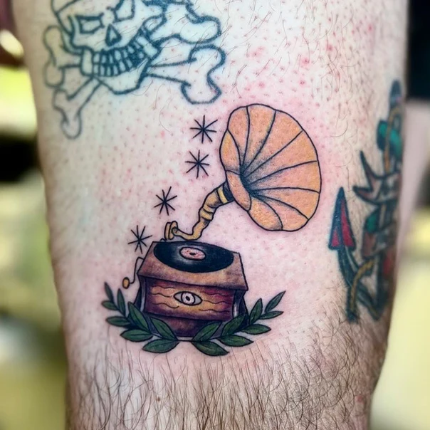 Old School Gramophone, Stars tattoo on Thigh