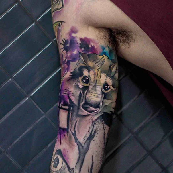 Illustrative Wolf, Tree tattoo on Upper Arm