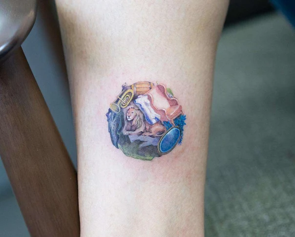 Illustrative Lion, Musical instruments tattoo on Thigh