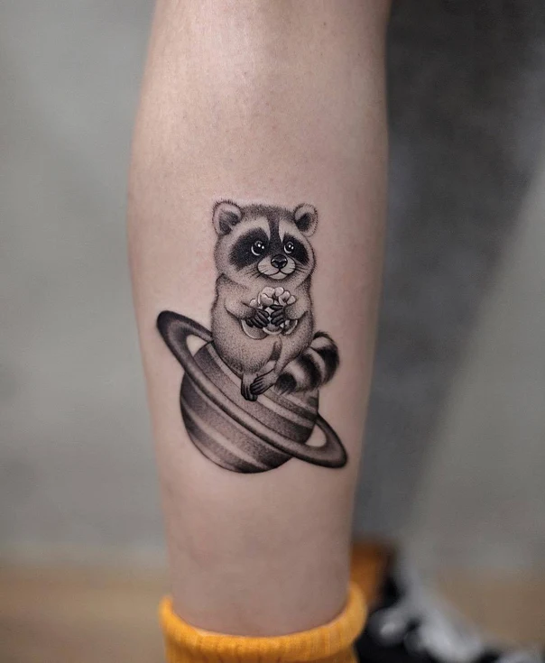 Black & Grey Raccoon, Planet tattoo on Calf