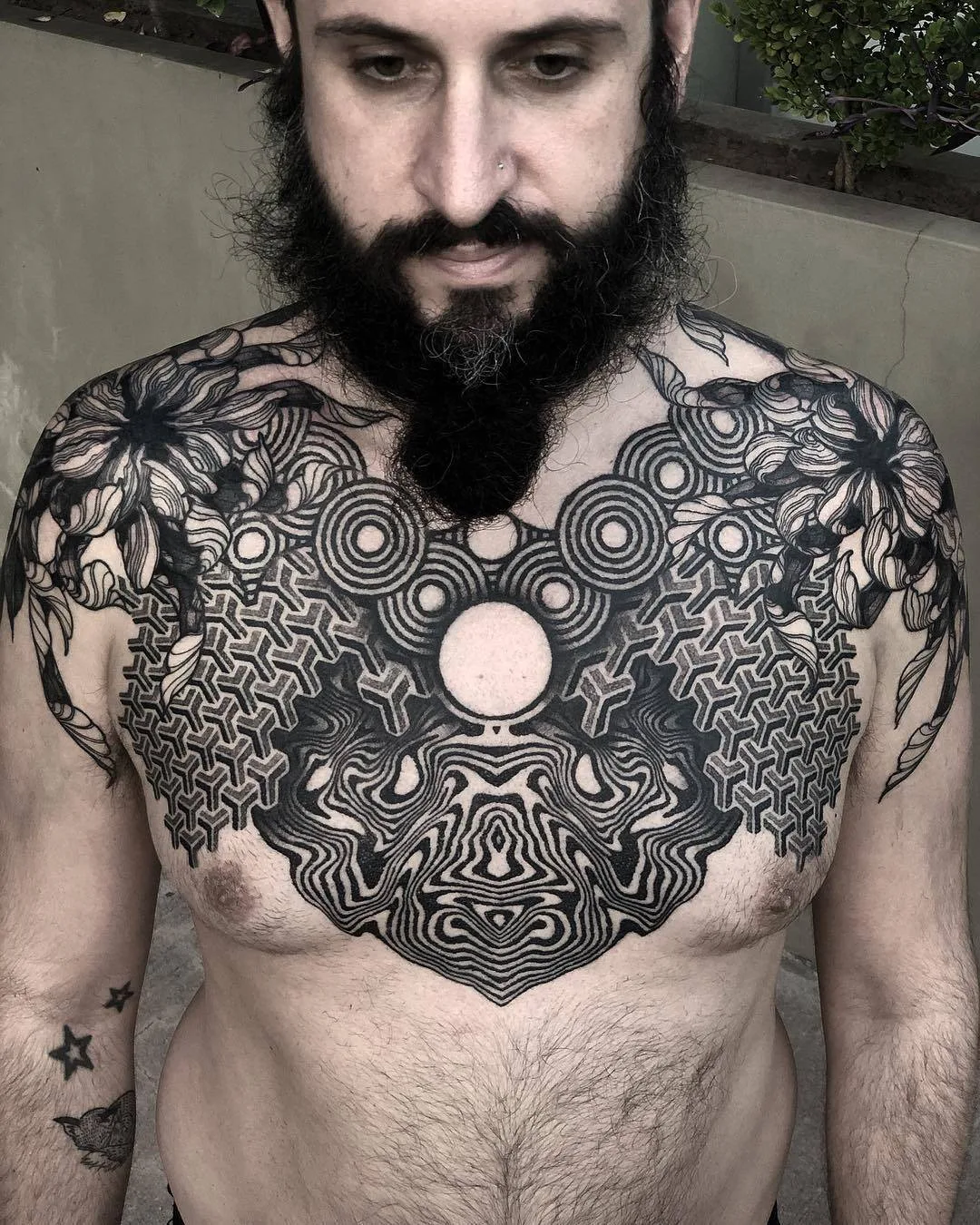 Tattoo artist Eric Stricker, black ornamental large scale tattoo | Buenos Aires, Argentina