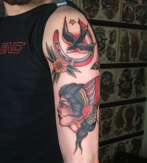 Traditional Swallow, Horseshoe tattoo on Upper Arm