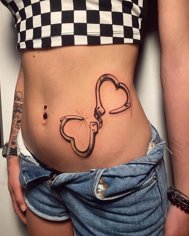 Blackwork Handcuffs, Heart tattoo on Stomach