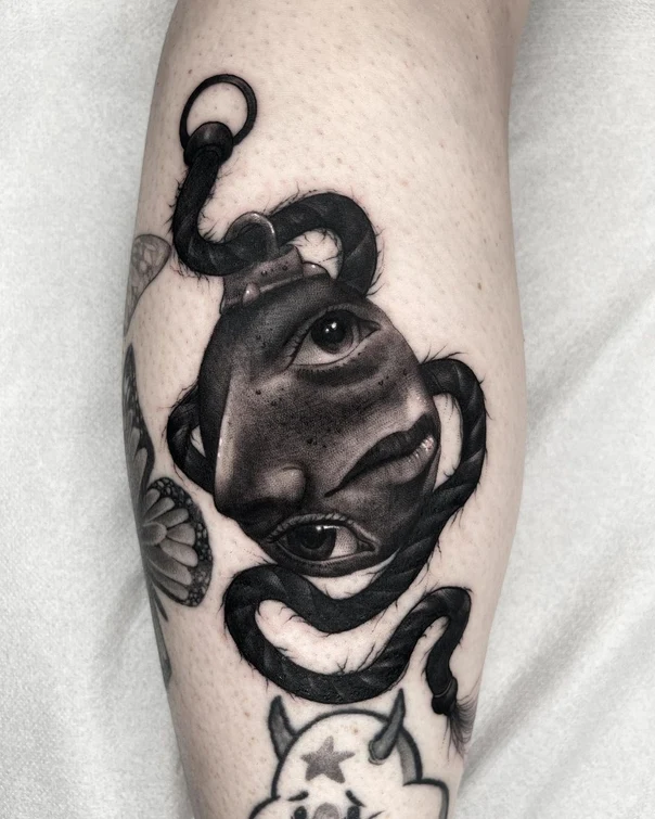 Black & Grey Eye, Face tattoo on Calf
