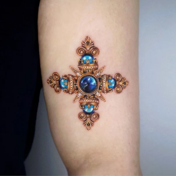 Realism Jewel, Cross tattoo on Thigh