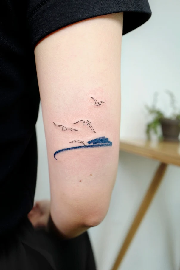 Fineline Birds, Ocean tattoo on Forearm