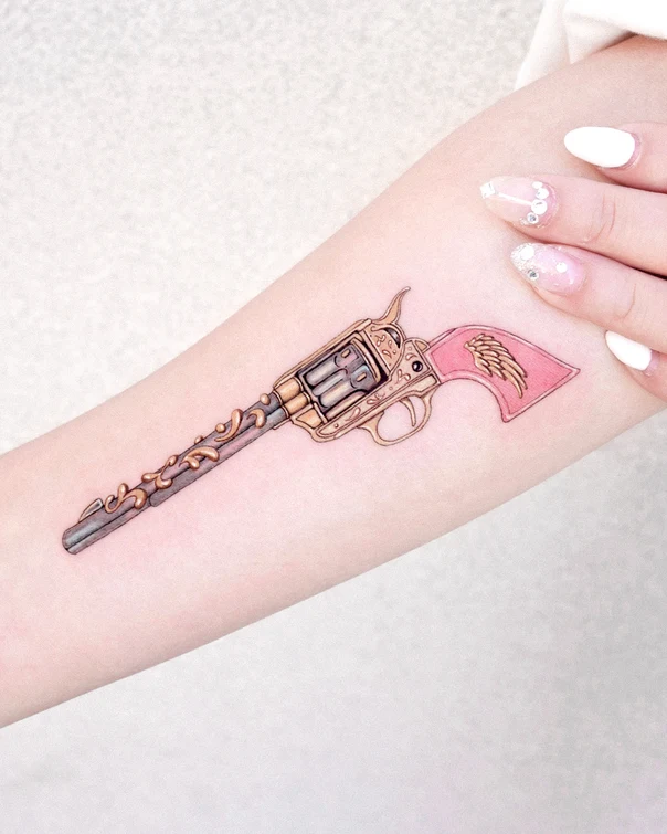Illustrative Gun, Wings tattoo on Forearm