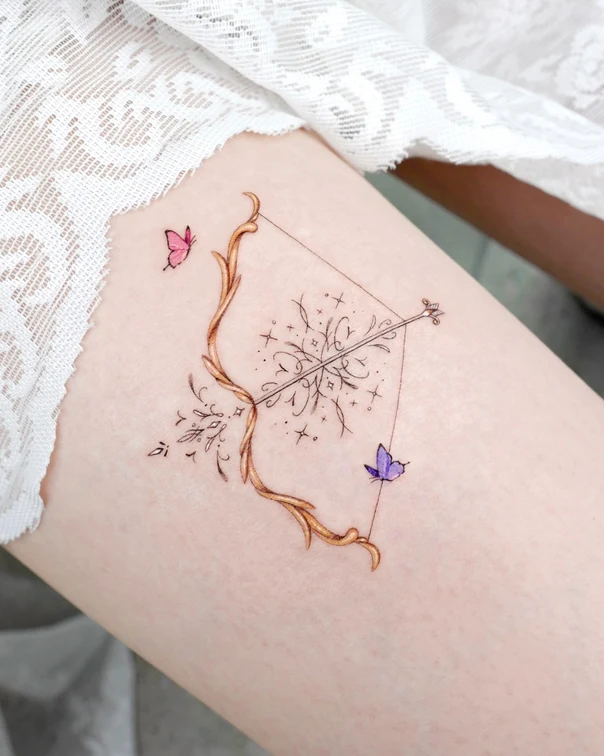 Fineline Bow and arrow, Butterfly tattoo on Thigh