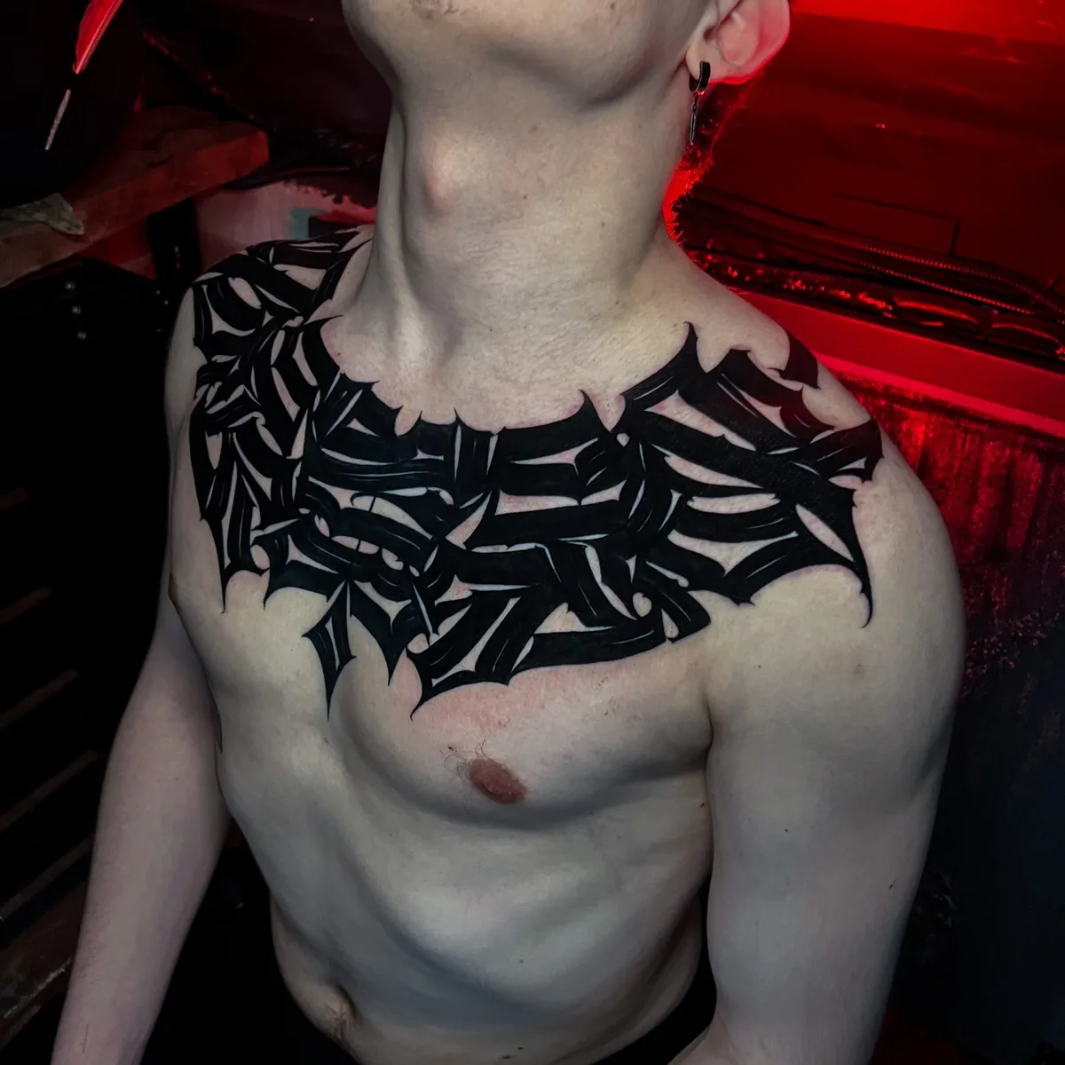 Lettering tattoo on a men chest - Igor Klimin