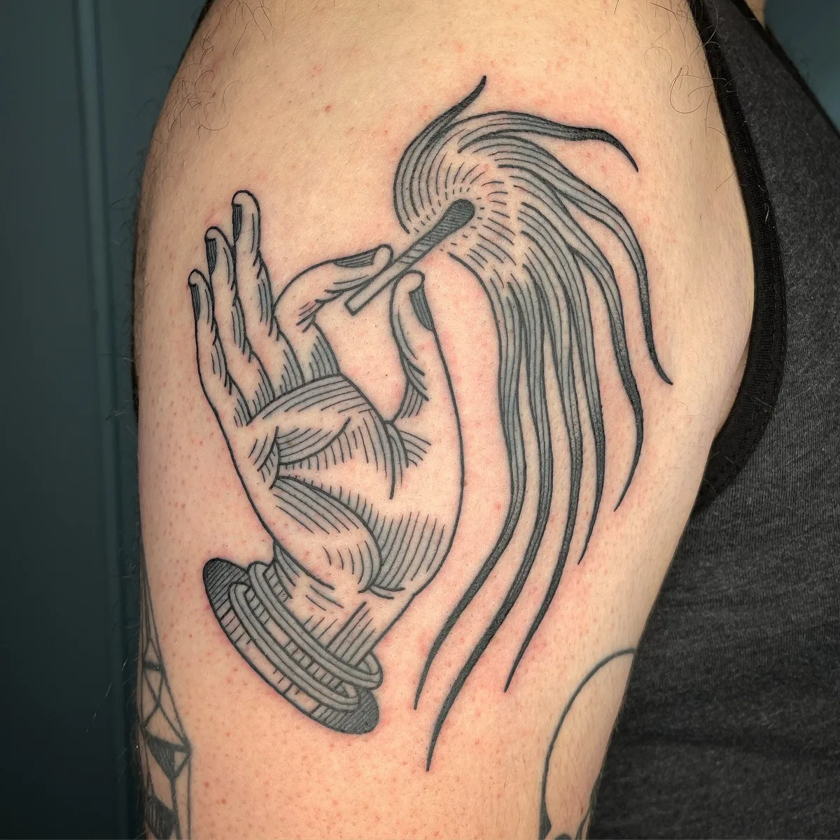 lit match tattoo engraving