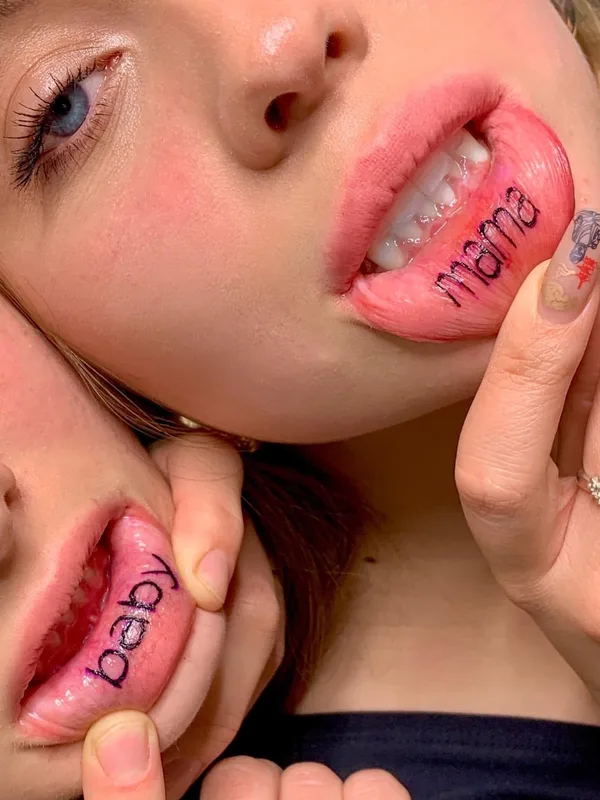 female black lettering tattoo on lip #71048 | Tattoo Artist Krasnodar Ink