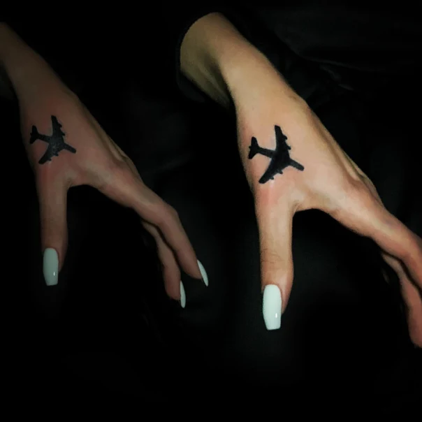 Blackwork Airplane tattoo on Back of Hand