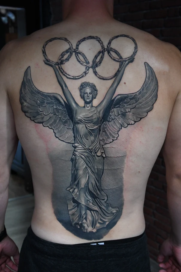 Realism Angel, Olympic rings tattoo on Full Back