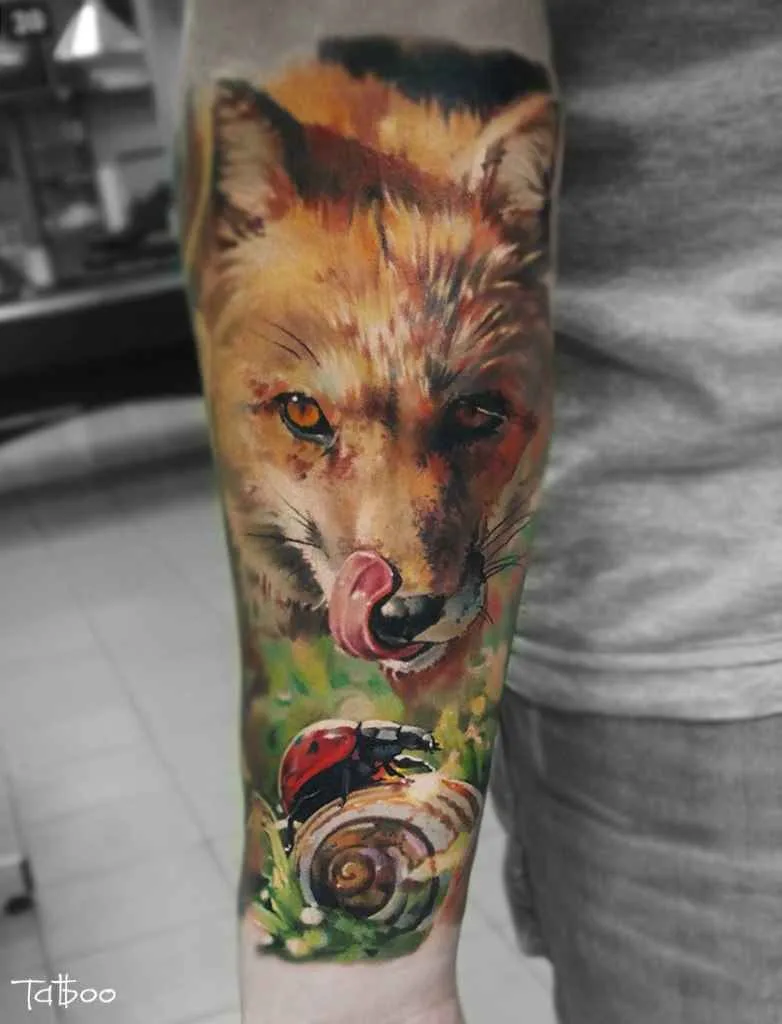 A colourful realistic tattoo of a fox licking its nose, with a ladybug and snail in the foreground among botanical elements.