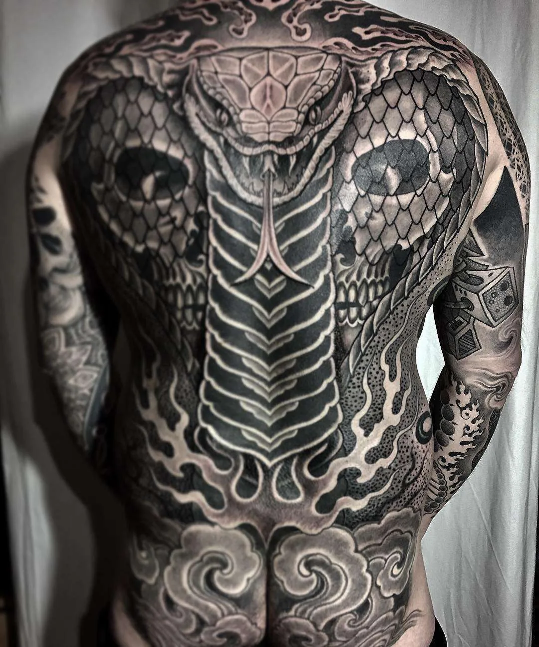 Tattoo artist Jondix, authors style black ornamental tattoo | United Kingdom