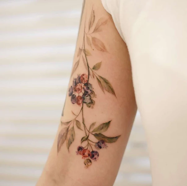 Watercolor Berries, Leaves tattoo on Forearm