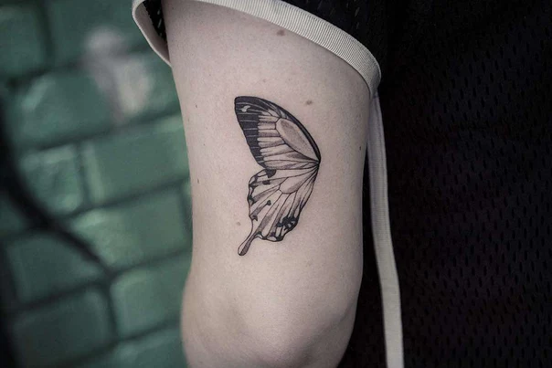 Fineline Butterfly tattoo on Bicep