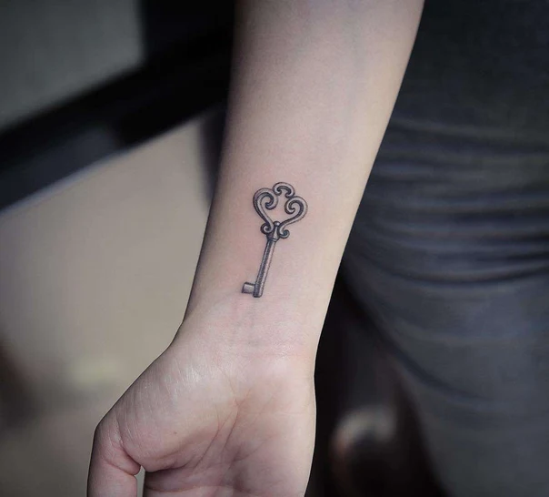 Fineline Key tattoo on Wrist