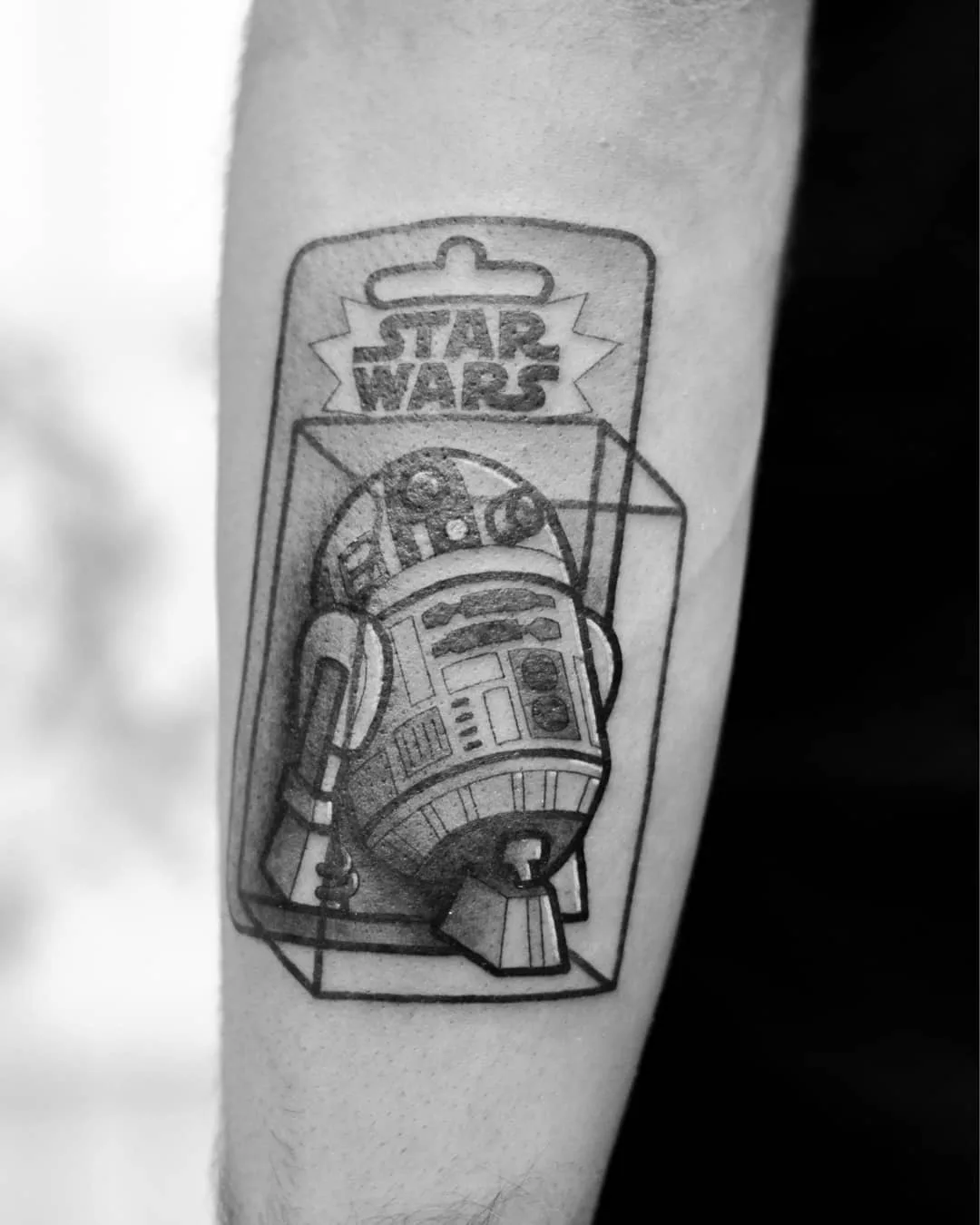 Tattoo artist Perou, author's black-and-grey cartoon tattoo | Sion, SSwitzerland