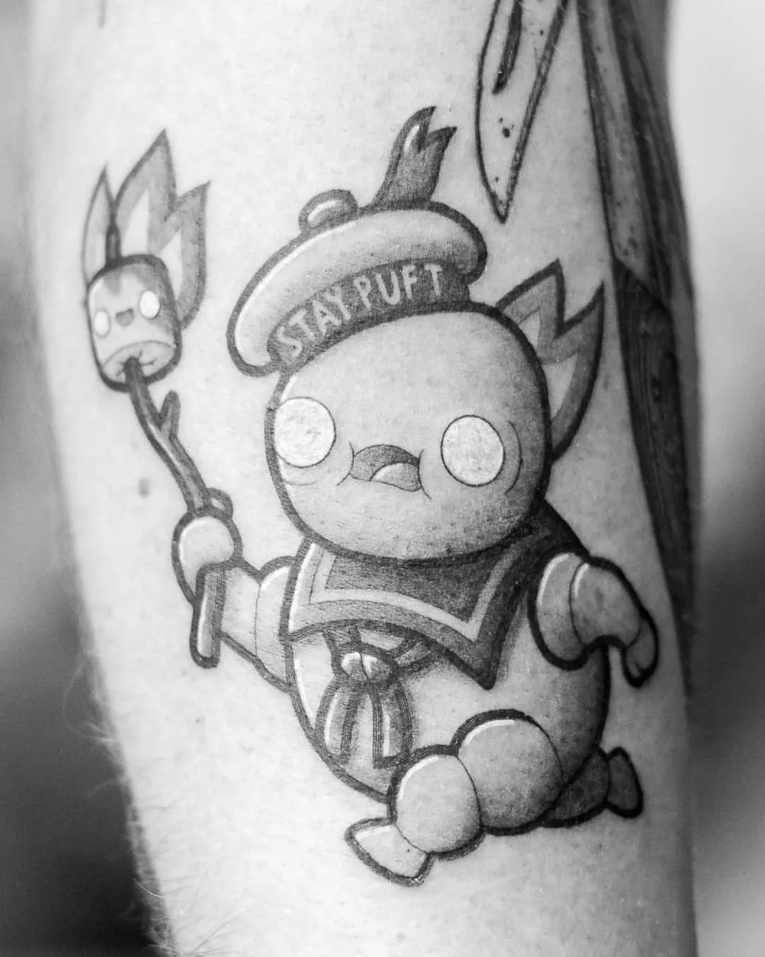 Tattoo artist Perou, author's black-and-grey cartoon tattoo | Sion, SSwitzerland