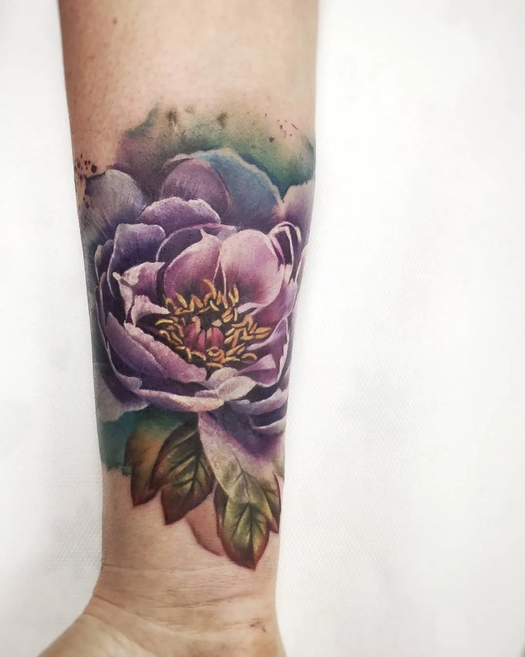 Tattoo artist Lianne Moule, color watercolor flowers tattoo | United Kingdom