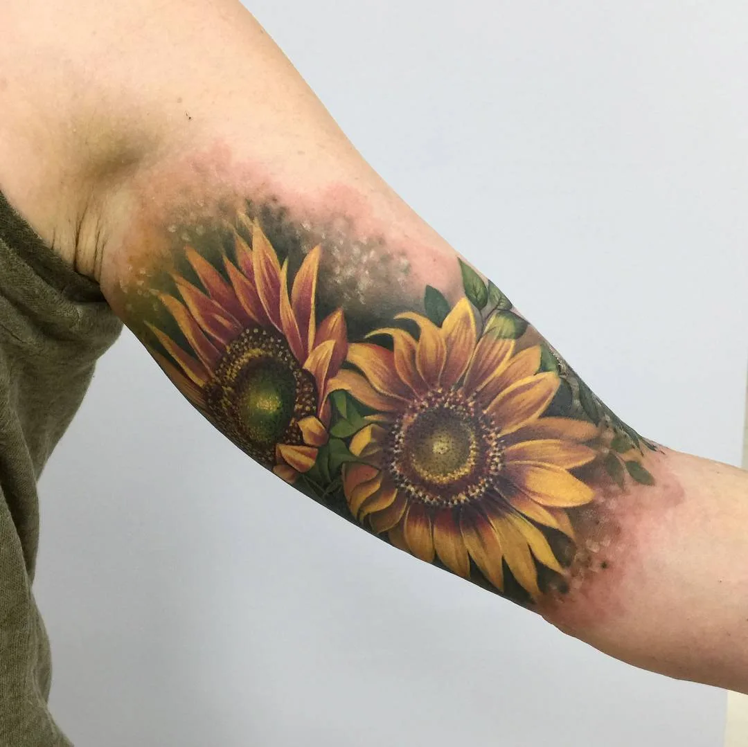 Tattoo artist Lianne Moule, color watercolor flowers tattoo | United Kingdom
