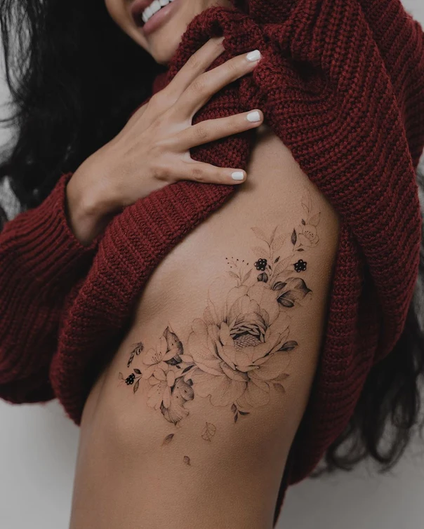 Fineline Flowers, Leaves tattoo on Ribcage